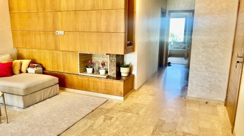 Salon avec chemine; appt a vendre a taddart; californie, Casablanca; vente; immobilier; realty success morocco; realtymorocco.com
